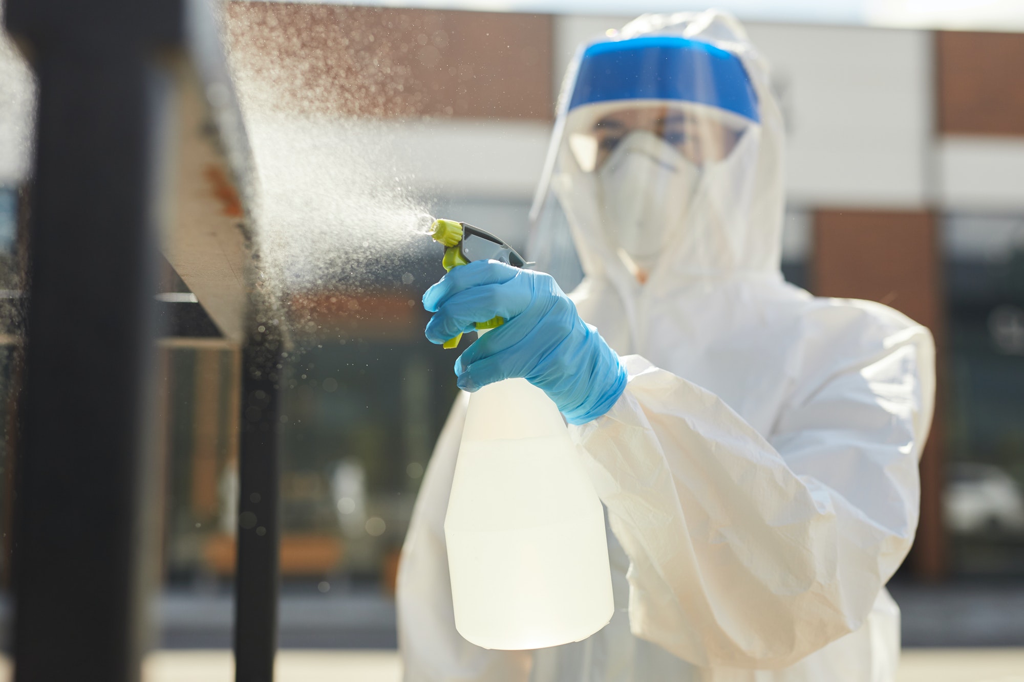 Female Worker Spraying Chemicals